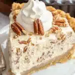 Best Pecan Cream Pie Recipe – Creamy, Nutty & Irresistible 10 Homemade pecan cream pie in a glass pie dish, with a buttery crust and a rich, nutty filling, ready to be served.