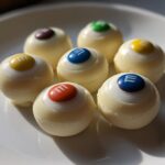 3-Ingredient Candy Eyeballs That Will Haunt Your Halloween Party 8 Candy Eyeballs (white chocolate & M&M centers)