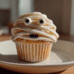 Spooky-Yet-Yummy 24 Mummy Face Cupcakes That'll Wow Guests! 6 Mummy Face Cupcakes
